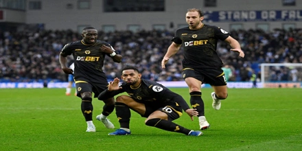 Wolverhampton-Wanderers-Matheus-Cunha-celebrates-scoring-their-second-goal-with-Carlos-Forbs-and-Craig-Dawson.jpg